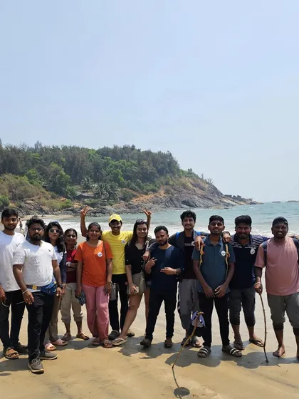 A group photo from our Gokarna beach trek, with the sea in the background.