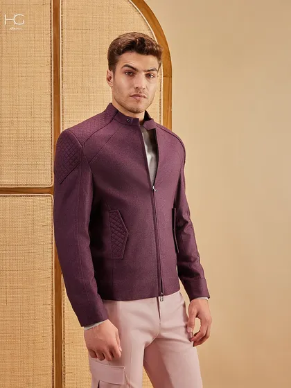 I believe in using color with intent. This combination of a structured maroon shacket with quilted details and muted pink trousers creates a look that is bold, balanced, and effortlessly modern.