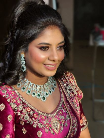 Remya's smile shows how much she loved her sangeet look. The half-up ponytail hairstyle was both elegant and comfortable.