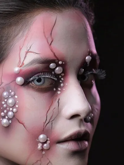 A profile view that reveals the intricate vein work and the texture created with the makeup.