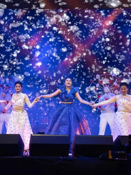 This bride's solo was a full production, complete with backup dancers and parasol props. The choreography was a beautiful blend of traditional and contemporary, creating a visually rich and entertaining performance.