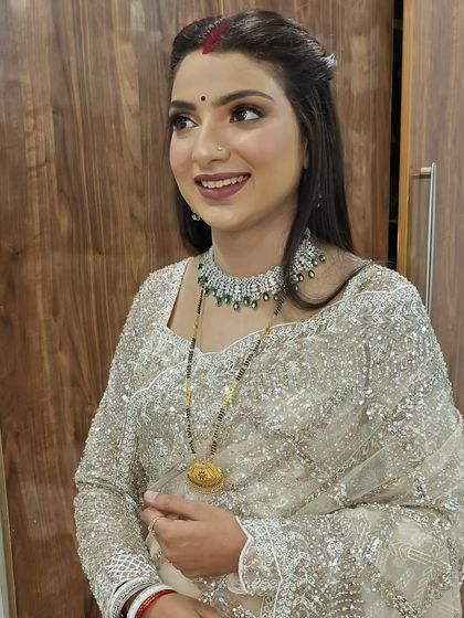 Another angle of this perfectly blended look. The focus is on clean skin and softly defined eyes and lips.