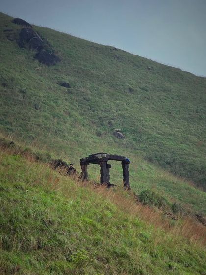 The iconic stone Mantapa along the Kumaraparvatha trail, a key landmark on the way to the peak.