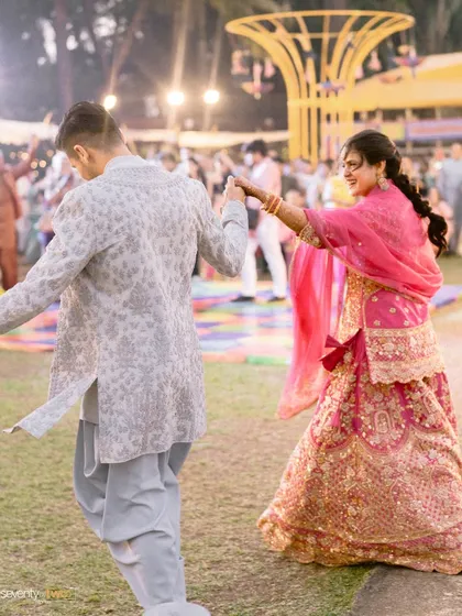 A dance of joy at their engagement party. This action shot captures the energy and happiness of the celebration, a candid moment of pure fun.