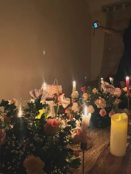 Another perspective of the candlelit 18th birthday picnic. This shot shows how the interplay of light and shadow from the candles creates a warm, intimate, and highly photogenic atmosphere for the celebration.