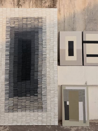 The full set of artworks for the residential space in Surat. It includes the large textured gradient piece and three smaller geometric abstracts, all designed to work together in a single room.