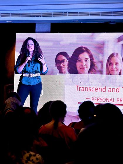 Engaging with the audience during a talk on transcending and transforming your personal brand. Knowing your audience is the first step to establishing a powerful connection.