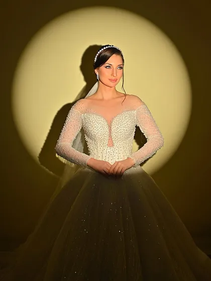 A full-length portrait of the bride, looking like she stepped right out of a fairytale.