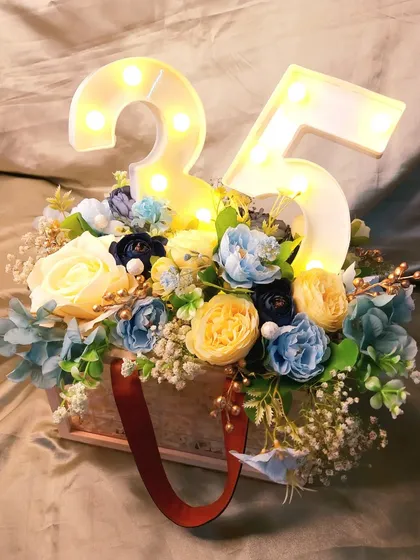 A still shot of the 25th birthday hamper. The marquee lights add a celebratory touch and make this a standout gift for a milestone birthday.