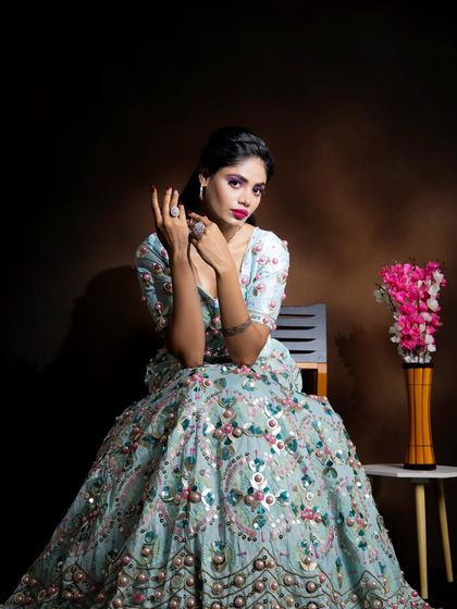 A confident pose showing off the modern ethnic makeup. This style is perfect for bridesmaids or wedding guests who want a look that is both trendy and appropriate for the occasion.