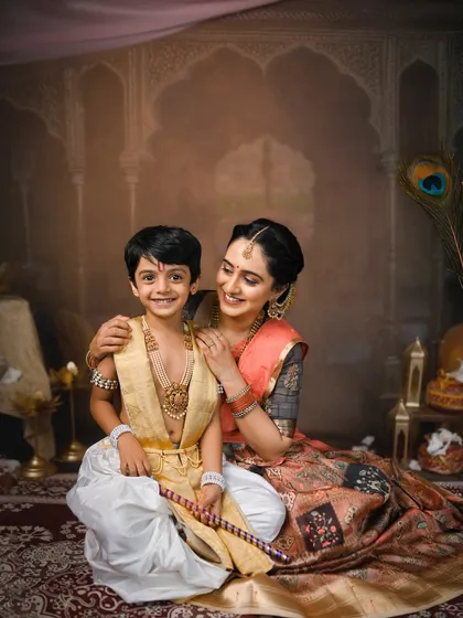 A mother and her older son dressed for a Krishna Janmashtami photoshoot. These sessions are wonderful for children of all ages, not just babies.