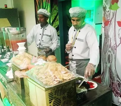 My chefs at a live chaat counter, ready to serve delicious street food to guests at a corporate event. Their expertise adds an authentic touch to the experience.