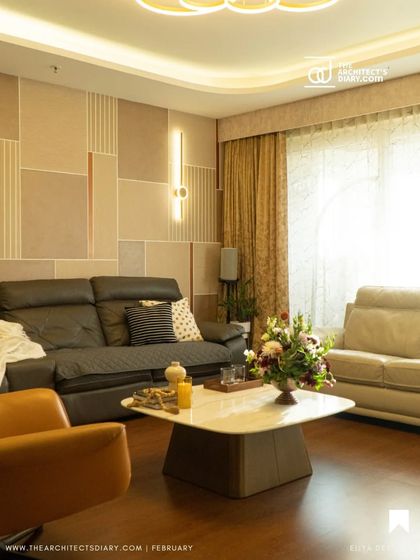 An image from our feature in The Architect's Diary, showcasing the living room of the Anagha residence with its unique wall paneling and warm, layered lighting.