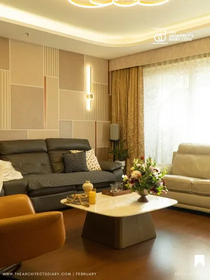 Inspired by Korean minimalism, this living and dining area uses a calm, neutral palette with clean lines and geometric patterns on the wall. The focus is on creating a serene and uncluttered environment with sophisticated lighting.