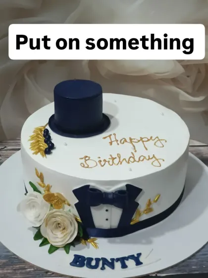 A dapper cake for a true gentleman. This design features a fondant tuxedo, top hat, and bow tie, making it a classy choice for a birthday celebration.
