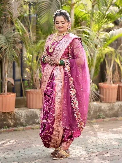 A full view of Meghana's stunning nauvari saree look, showing how the draping and makeup come together for a regal effect.