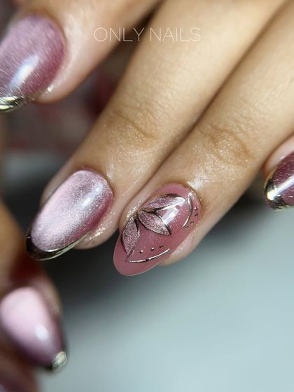 A detailed close-up of the hand-painted floral accent nail. The delicate silver lines and dots complement the cat eye base and chrome tips, tying the whole look together.