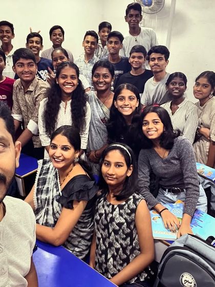A full class photo with teachers and students on Grey day.