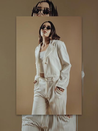 A confident pose from the same editorial. The makeup contributes to the overall mood and power of the image.