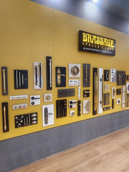 Our "mood board" wall at IndiaWood Bangalore 2024, showcasing a curated selection of our most popular and innovative designs against a vibrant yellow backdrop.