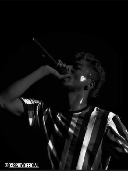 This black and white shot captures the intensity of a college concert. I always play till I sweat, giving all my energy to make the show a memorable one for the students of AJIET.