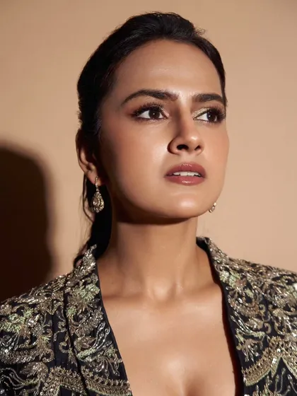 A close-up of the embroidered jacket I styled for Shraddha Srinath. This piece adds a touch of glamour and intricate detail to a simple black outfit, making it perfect for an evening event.