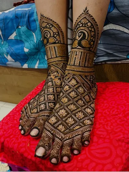 A beautiful foot design with a net pattern and peacock motifs.