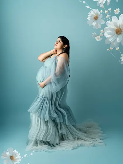 An artistic composition with floral elements, this portrait in the blue gown has a dreamy, almost magical quality.