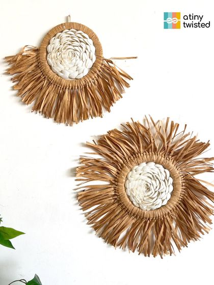 A closer look at my boho-chic wall hangings that combine macramé with natural raffia. The contrast in textures creates a beautiful, organic feel.