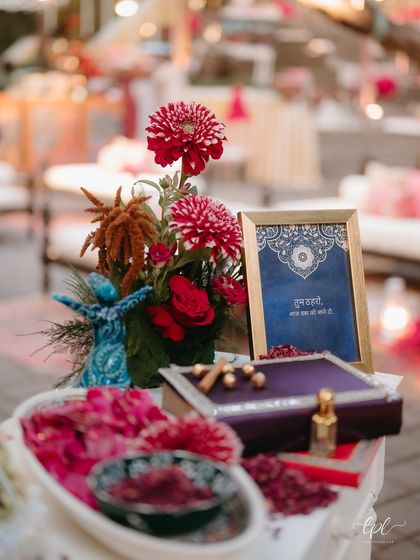 Details from the Kashmiri Sufi setup, including a miniature whirling dervish, fragrant rose petals, and a framed quote, all designed to evoke a sense of serenity.