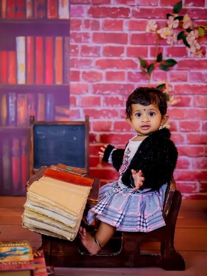 A gallery of our popular school and library theme. These images show the versatility of the brick wall backdrop, mini school desk, globe, and book props for creating a variety of scholarly and classic portraits.