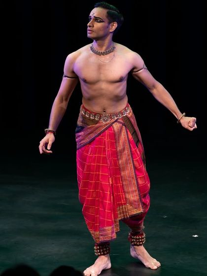 A full-body shot from the Canada tour, showing the traditional costume and posture.