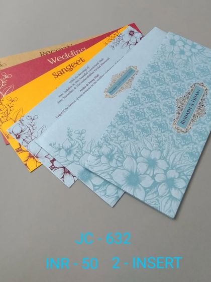 This simple and affordable invitation set comes with a blue floral cover and inserts in various festive colors. It's a great budget-friendly option for a colorful wedding.