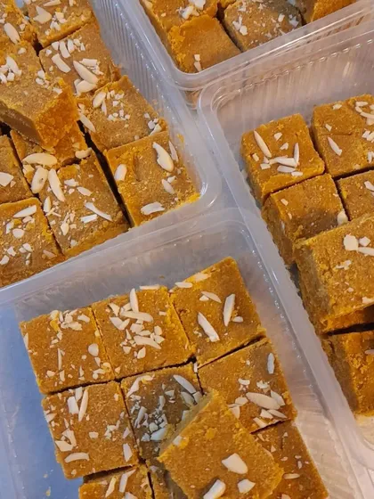 Batches of our gluten-free Besan Barfi, ready to be packed. I make sure every piece is perfectly cut and garnished.