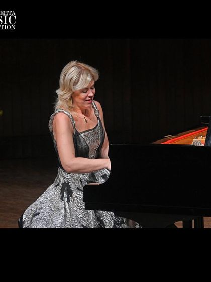 An intimate shot of Olga Kern, showcasing her deep connection to the music as she performs.