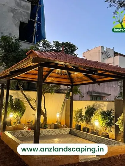 We also build classic structures that blend with traditional architecture. This garden gazebo features a sturdy wooden frame and a classic Mangalorean tile roof, with integrated lighting that creates a warm and inviting atmosphere in the evening.