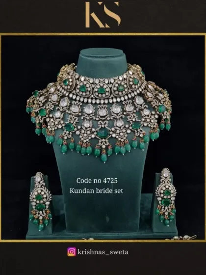 A premium quality Kundan bridal set with a classic design. The choker is adorned with uncut stones and green beads, creating a timeless look.