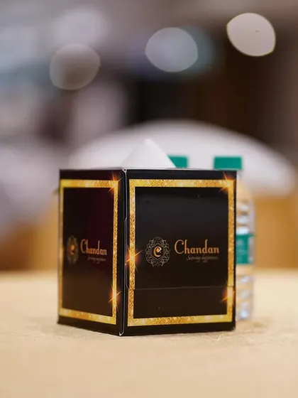 My custom-branded tissue box, a small detail that reinforces the premium quality and thoughtful service I provide at every event.