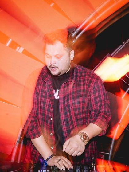 A long-exposure shot capturing the motion and energy of me mixing. This visual represents how I craft the night's soundtrack.