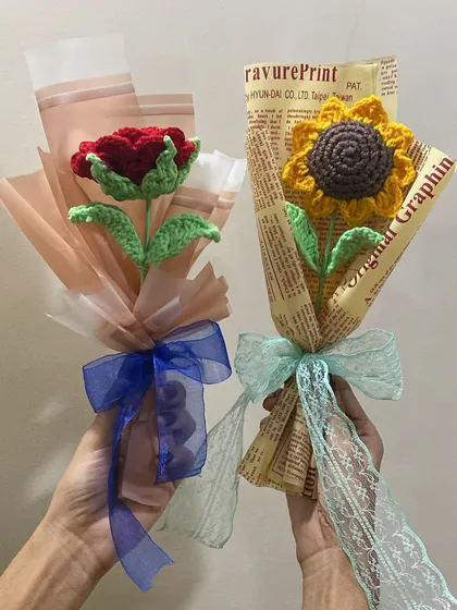 Two single-stem bouquets held side-by-side. One is a classic red rose, and the other is a cheerful sunflower, showing two very different but equally beautiful options.