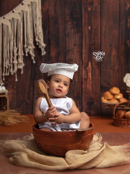 This little chef is busy baking up some cookies! Our rustic bakery theme is a sweet and creative way to capture your baby's playful personality.