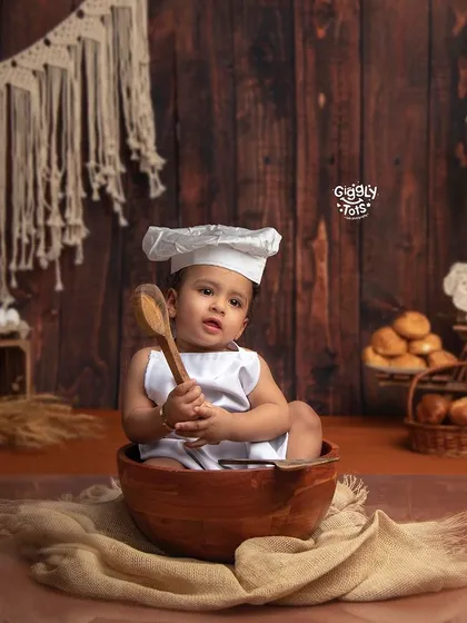 Baking up some cookies! A little chef sits in a mixing bowl, ready to create some delicious treats in our rustic bakery setup.
