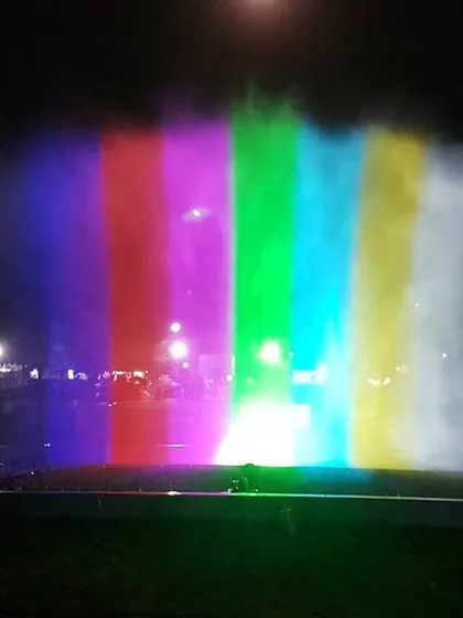We transform water into a dynamic canvas for light and color. This image captures our water screen projection technology, where high-powered projectors display vibrant visuals onto a fine mist. The result is a stunning, holographic-like effect ideal for large-scale outdoor events, brand activations, and public festivals.