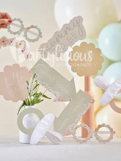 Adorable baby shower photo booth props, including 'mummy to be' glasses and 'coming soon' signs, perfect for capturing fun memories.