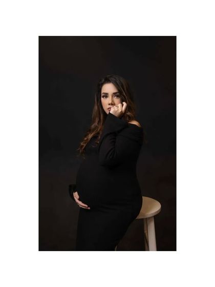 A duplicate of image 187, this pensive black and white portrait uses low-key lighting to create a moody and intimate atmosphere.