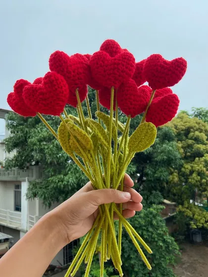 A simple, beautiful bouquet of red heart-shaped flower stems.