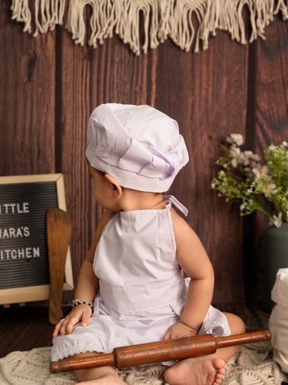 A behind-the-scenes look at little Diara in her kitchen. This candid shot captures a quiet moment before she starts cooking up some fun.