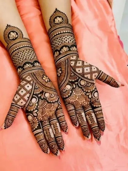 An elegant design featuring prominent lotus mandalas on the back of the hands and wrist, symbolizing beauty and purity.