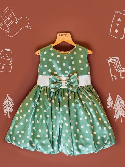 This green polka dot bubble dress is as fun as it is stylish. Made from a soft satin, it's comfortable enough for summer play while still looking wonderfully chic.