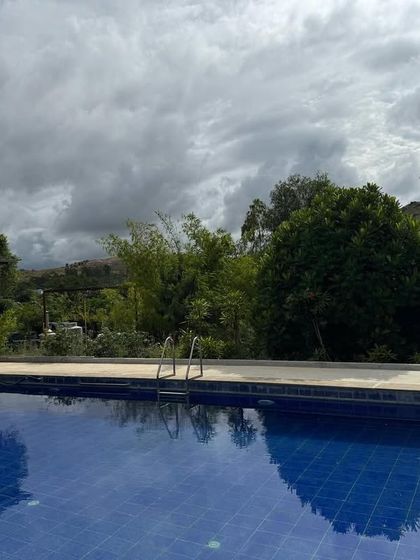 Our swimming pool offers a place for gentle exercise or simple relaxation, with a stunning view of the hills. Even on a cloudy day, the serenity of the location is palpable.